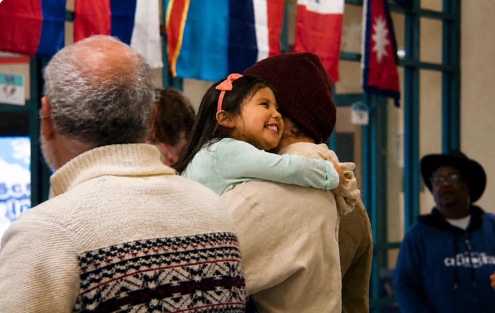 A child sharing a hug at a Rhythm Church gathering