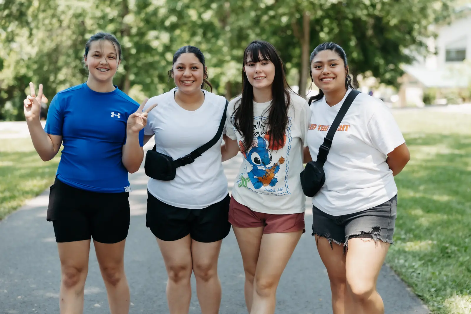 Four friends smiling together