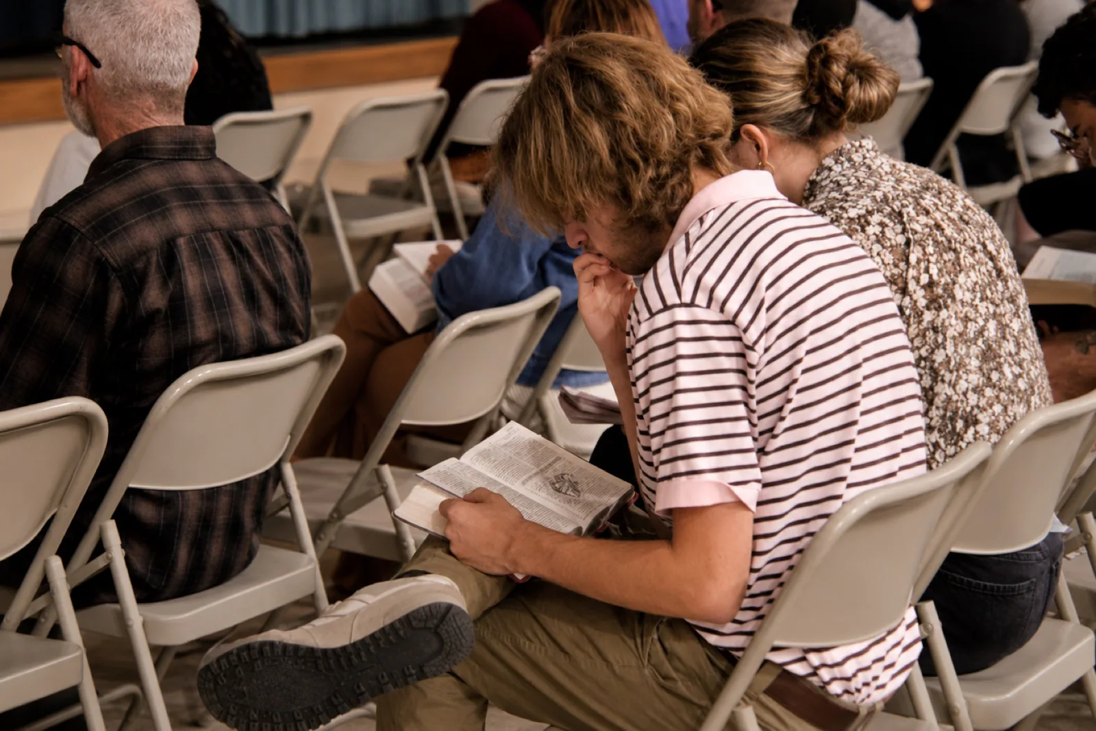 People reading the Bible during a Rhythm Church gathering