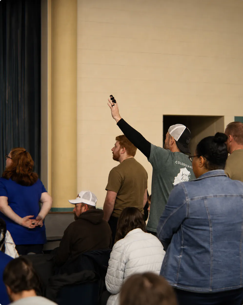 A person responding during worship at Rhythm Church