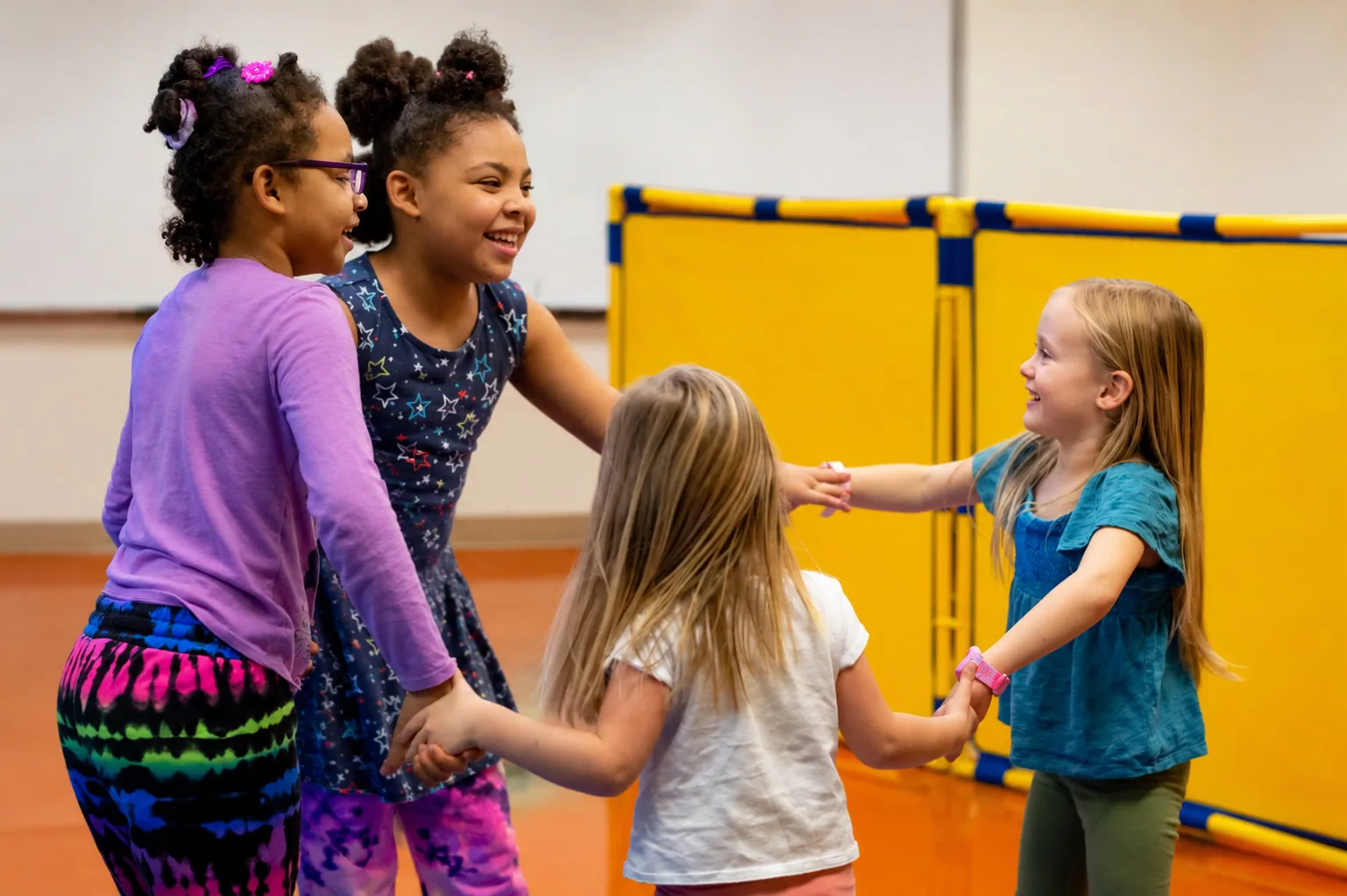Four girls dancing together in Rhythm Kids
