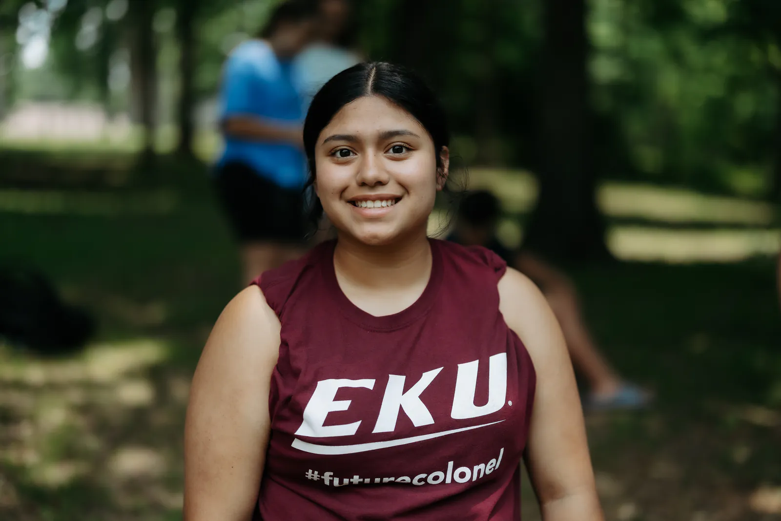 A young woman smiling during a Rhythm Church missions outreach